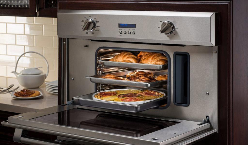 Andrew repairing an electric oven in a Perth kitchen